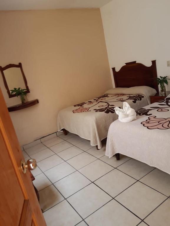 Postel nebo postele na pokoji v ubytování HOTEL CAMELINAS AREA BLANCA