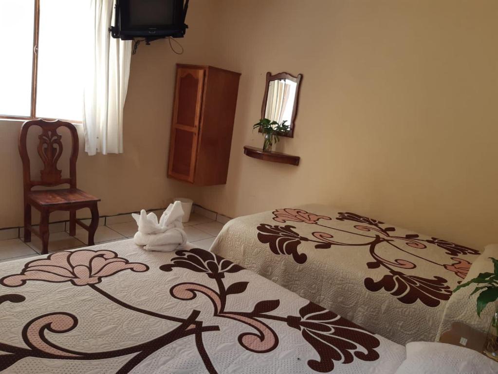 Postel nebo postele na pokoji v ubytování HOTEL CAMELINAS AREA BLANCA