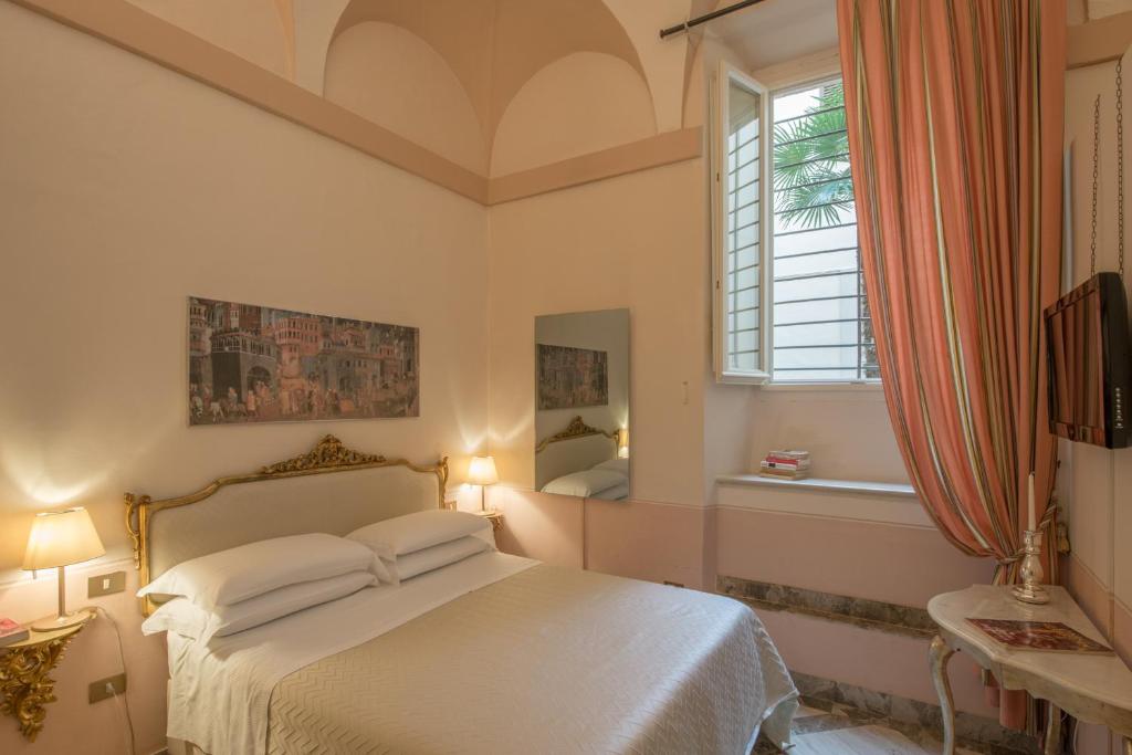 Postel nebo postele na pokoji v ubytování Palazzo Rotati