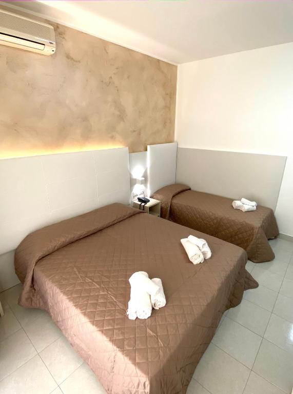 Postel nebo postele na pokoji v ubytování Hotel Bahia