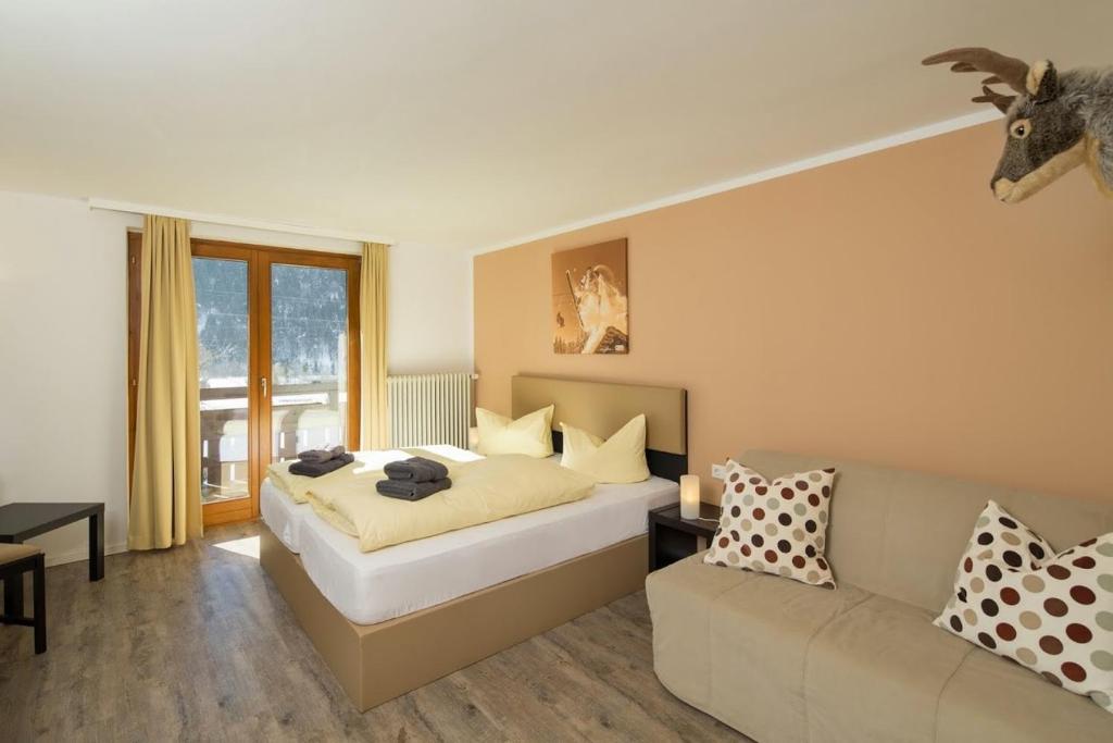 Postel nebo postele na pokoji v ubytování T3 Gasthof Spullersee