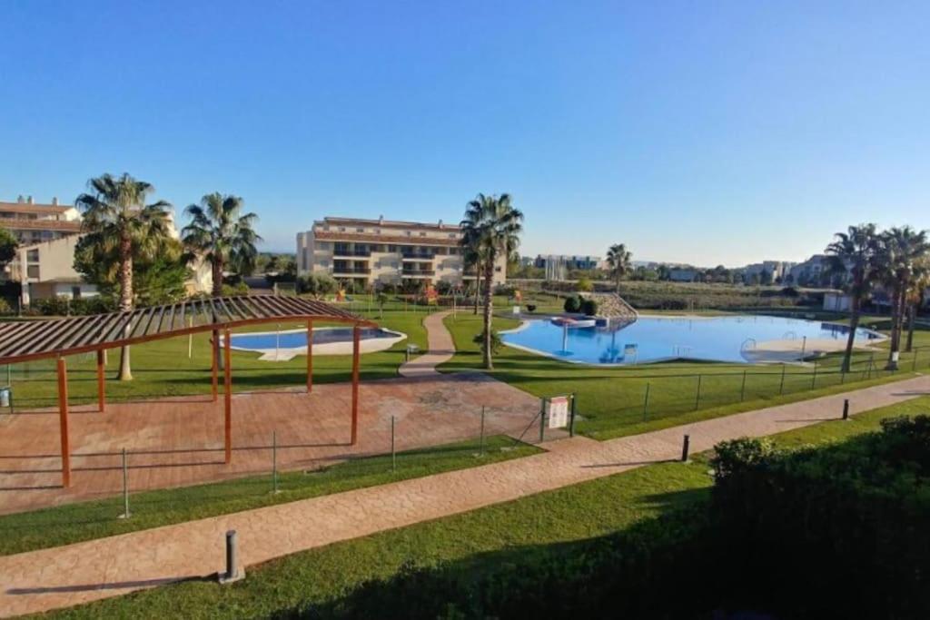 a view of a park with a swimming pool at Apartment Panoramica Golf in Sant Jordi