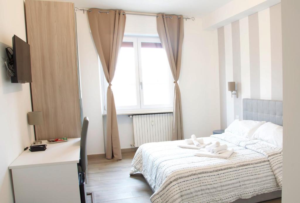 Postel nebo postele na pokoji v ubytování Minerva Rooms