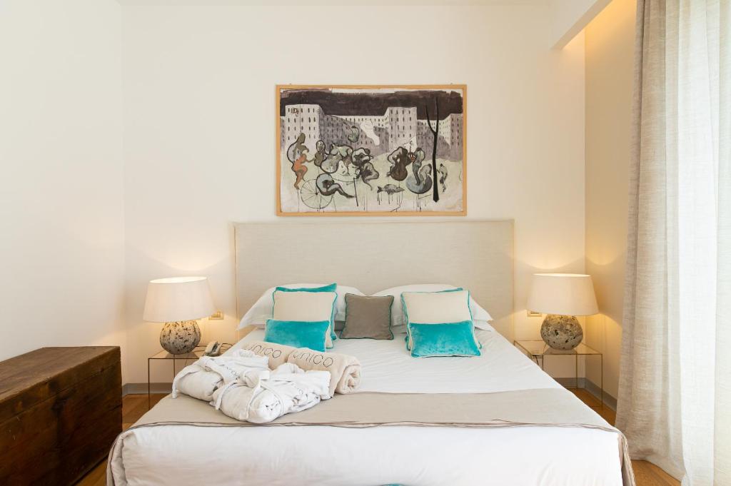 Кровать или кровати в номере Unìco Boutique Hotel d'Arte