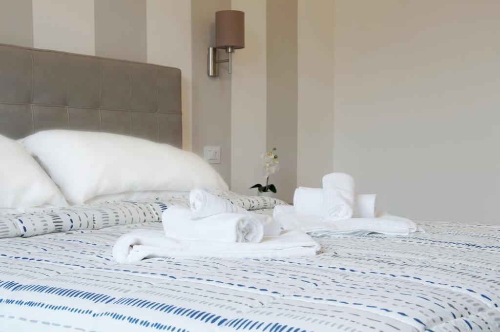 Postel nebo postele na pokoji v ubytování Minerva Rooms