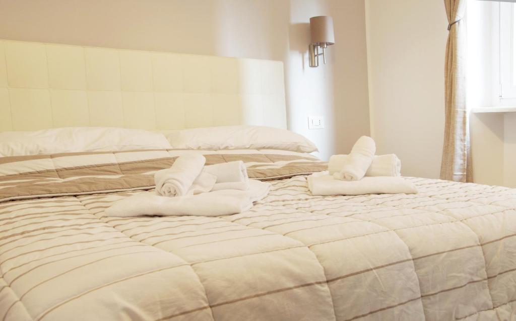 Postel nebo postele na pokoji v ubytování Minerva Rooms