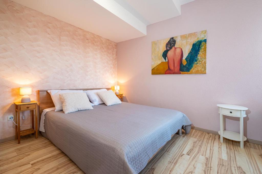 Postel nebo postele na pokoji v ubytování Poseidon Apartmani