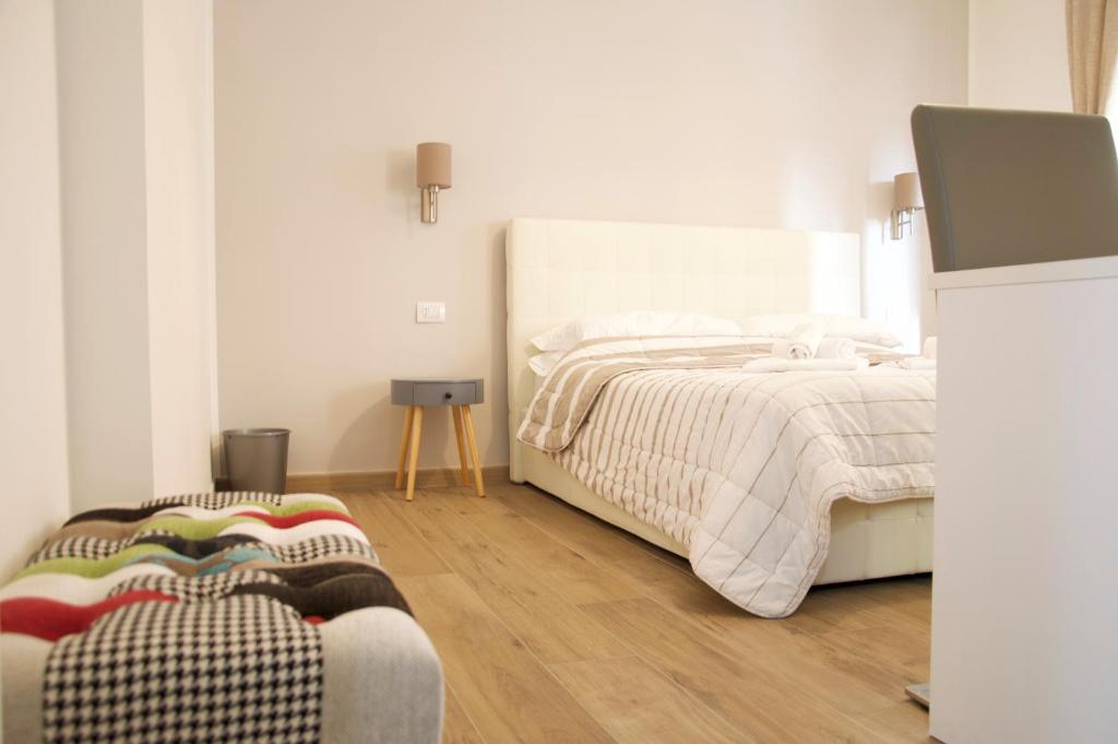Postel nebo postele na pokoji v ubytování Minerva Rooms