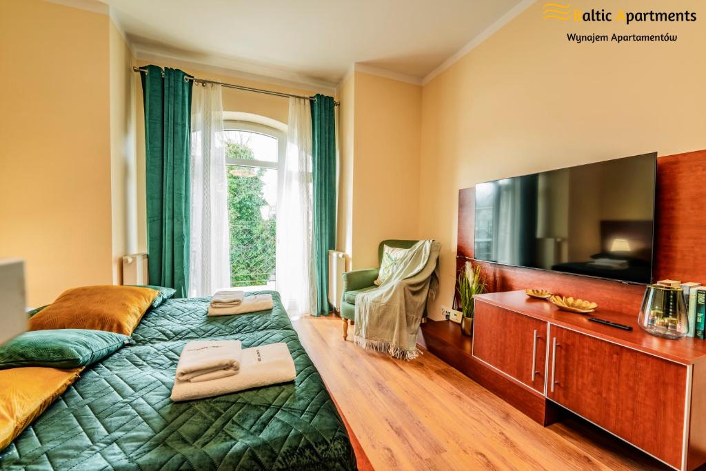 TV a/nebo společenská místnost v ubytování Baltic Apartments - Regina Maris
