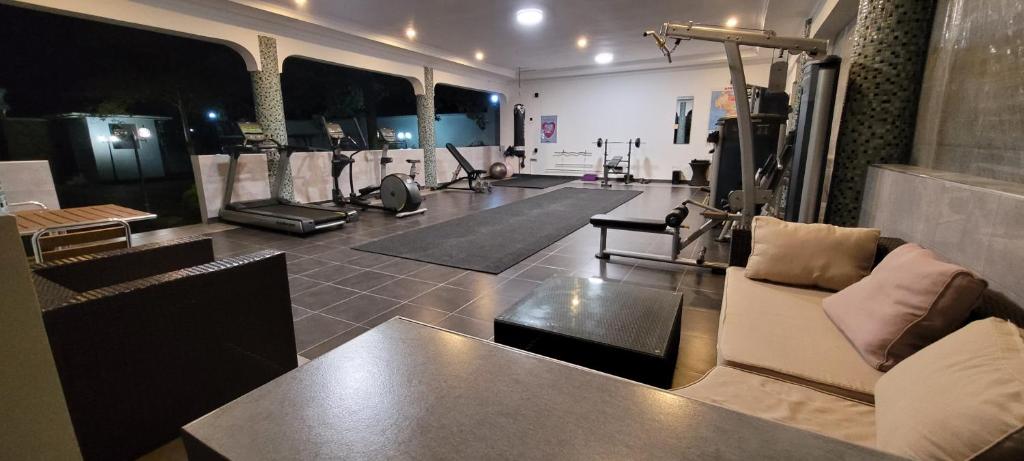 a room with a gym with pilates equipment at Different in Bagamoyo