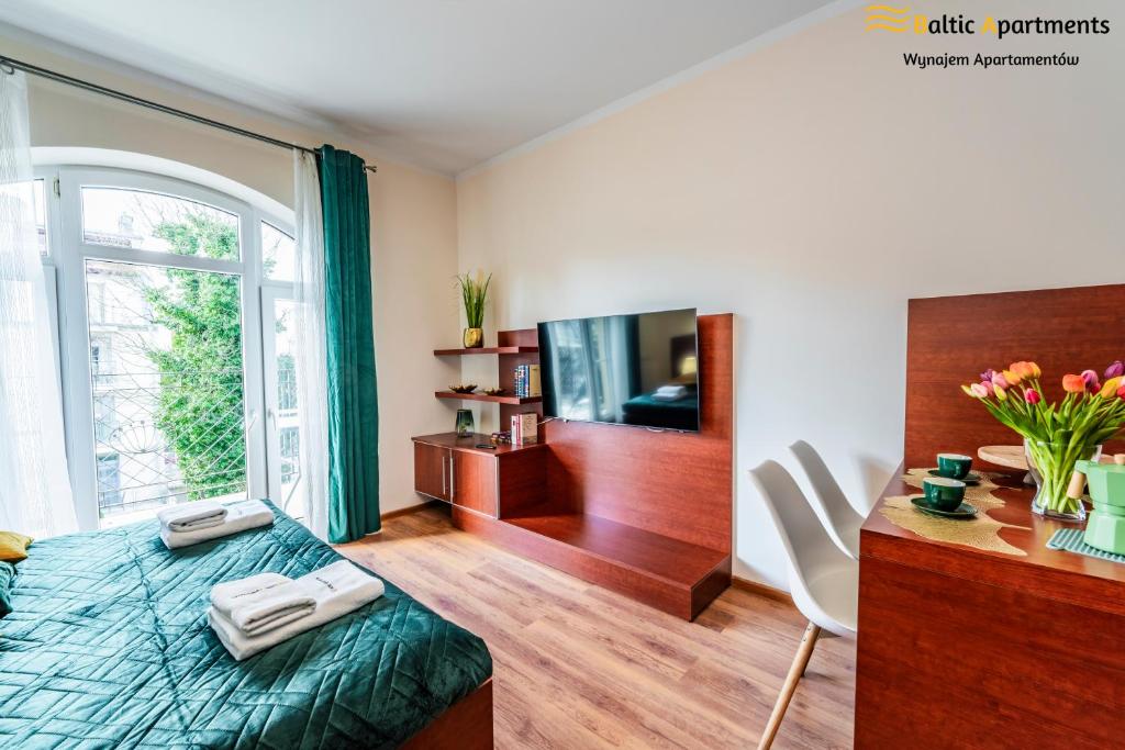 TV a/nebo společenská místnost v ubytování Baltic Apartments - Regina Maris