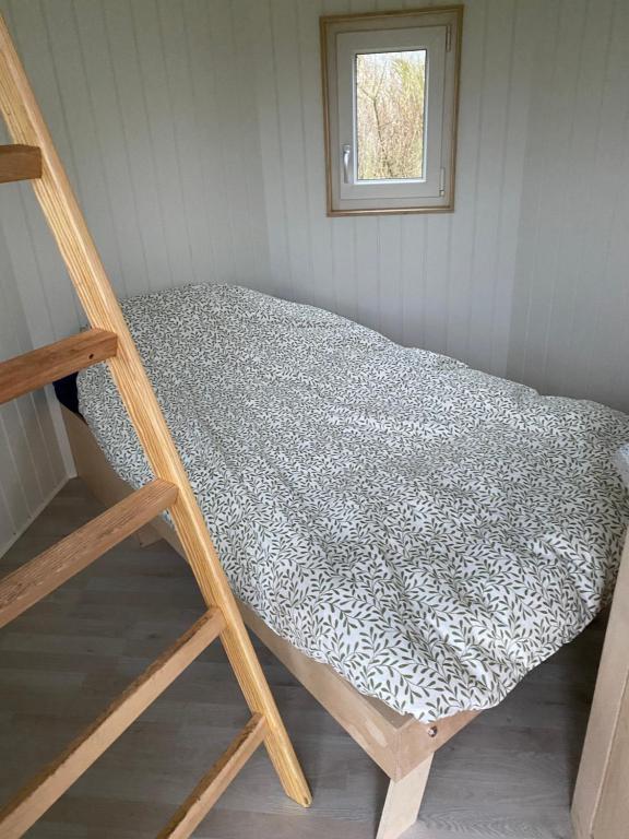 Postel nebo postele na pokoji v ubytování Kroghs Tiny Houses - Hyttebyen