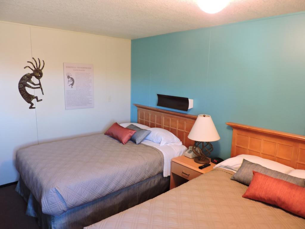 Postel nebo postele na pokoji v ubytování Kokopelli Inn