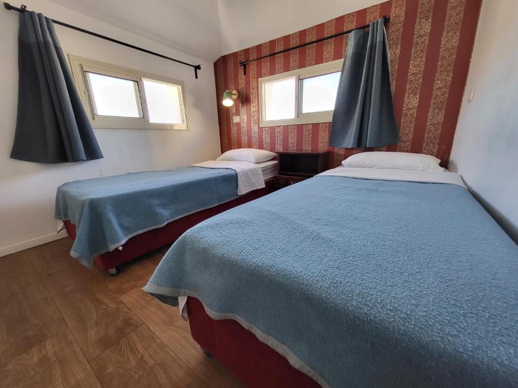 Postel nebo postele na pokoji v ubytování Haifa Hostel