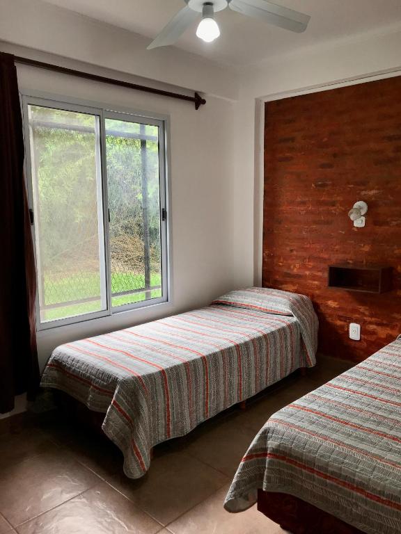 Postel nebo postele na pokoji v ubytování Bendito Alcázar Cabañas