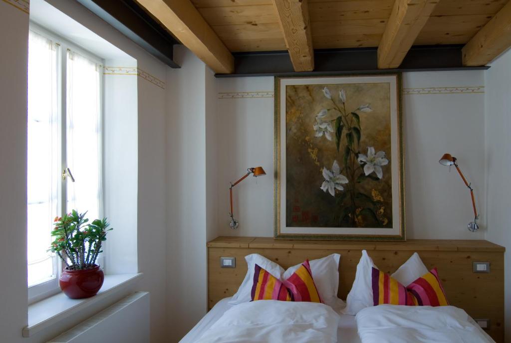 Postel nebo postele na pokoji v ubytování Locanda Tana de 'l Ors