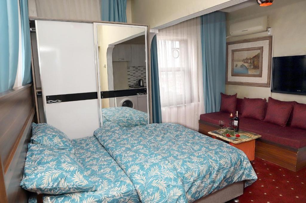 Postel nebo postele na pokoji v ubytování Afrodit Apart