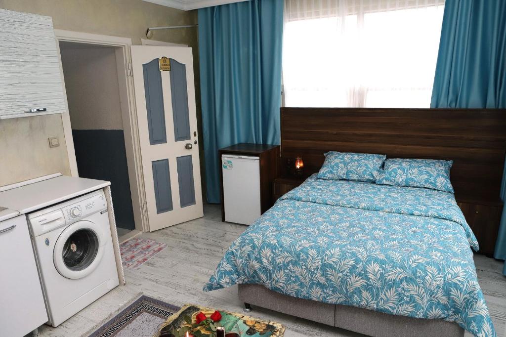 Postel nebo postele na pokoji v ubytování Afrodit Apart