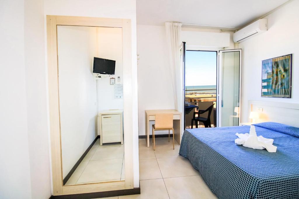 Postel nebo postele na pokoji v ubytování Hotel Duca di Kent