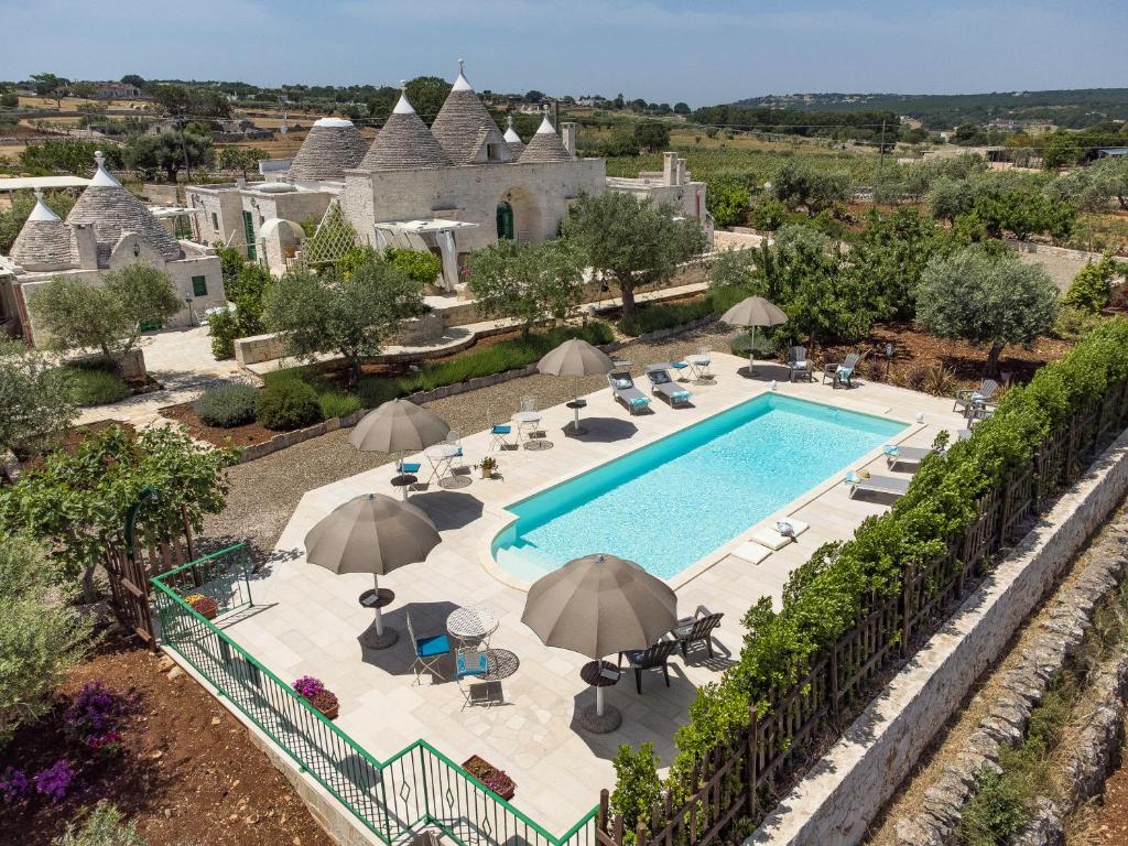 an aerial view of a villa with a swimming pool at Il Carpino in Martina Franca