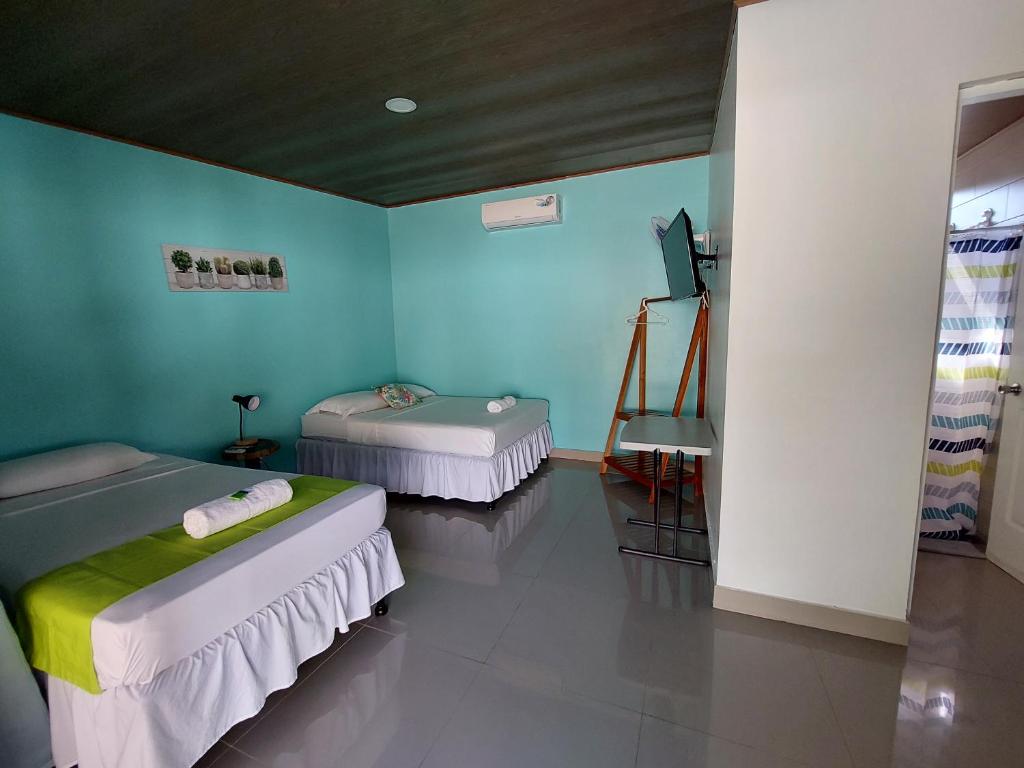 Postel nebo postele na pokoji v ubytování Hotel Carlota Tamarindo