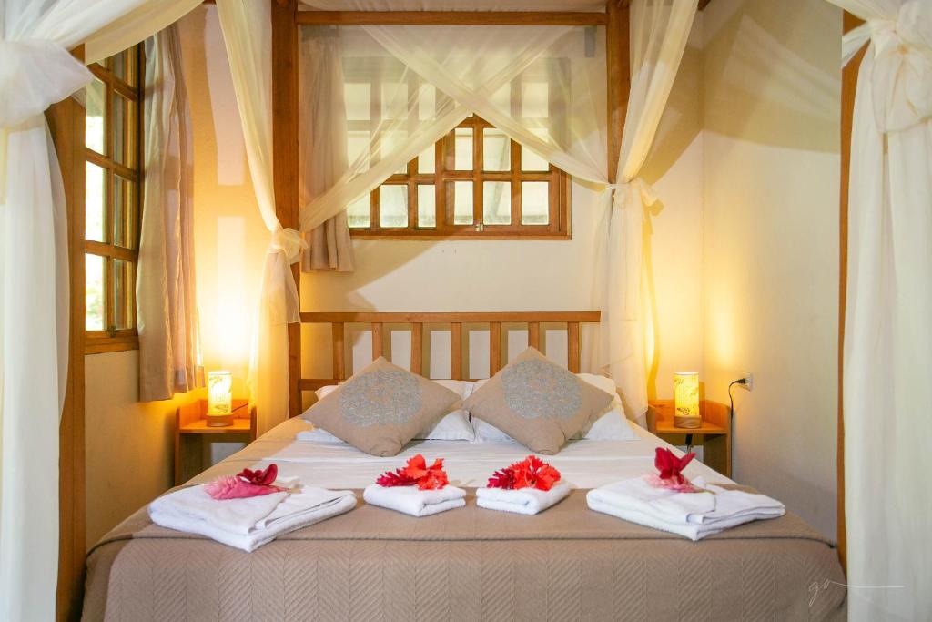 Postel nebo postele na pokoji v ubytování Hotel Casa Merlin
