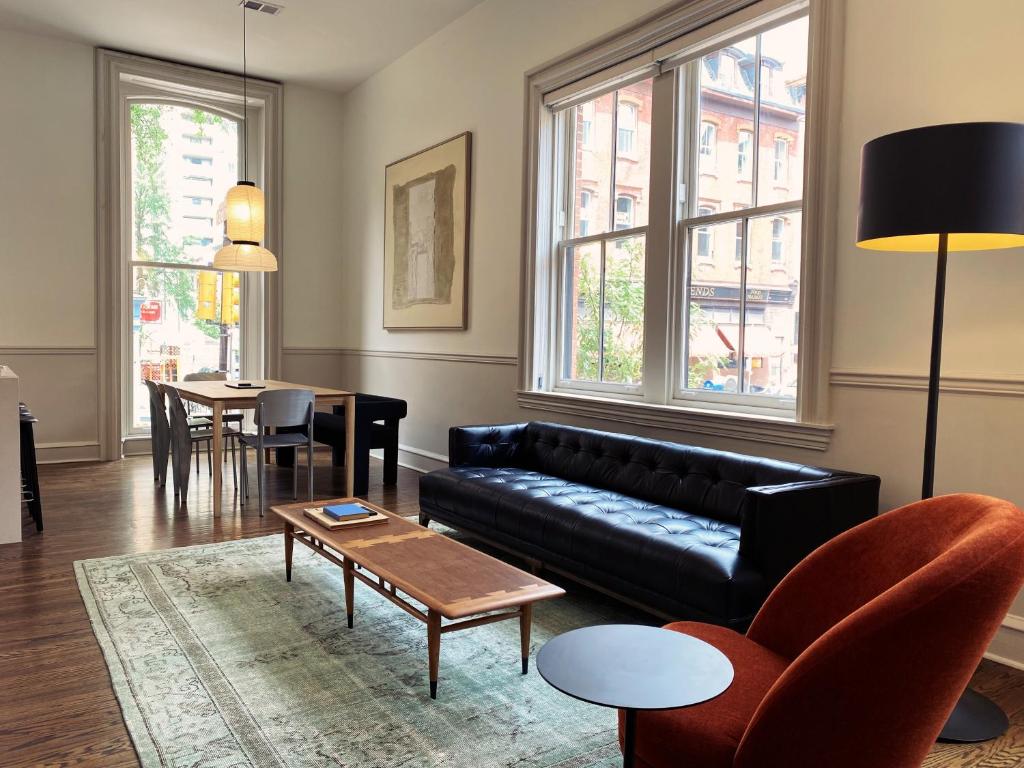 a living room with a couch and a table at Stay Rafa At 2000 Spruce in Philadelphia