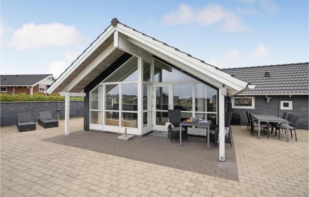 a pavilion with a table and chairs on a patio at Amazing Home In Vinderup With Wifi in Vinderup