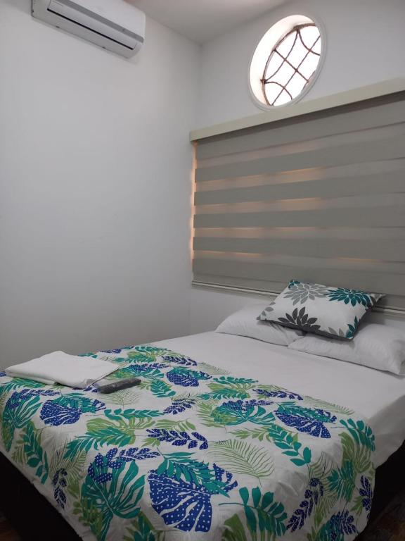Rúm í herbergi á Hotel Santa Fe del Parque
