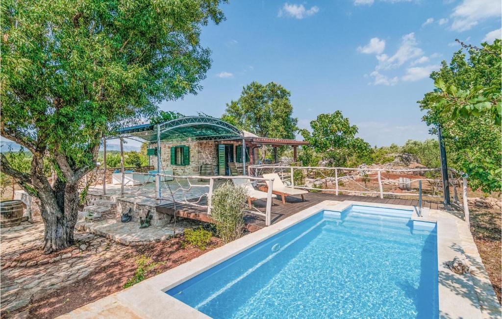 an image of a house with a swimming pool at Beautiful Home In Stari Grad With Wifi in Stari Grad