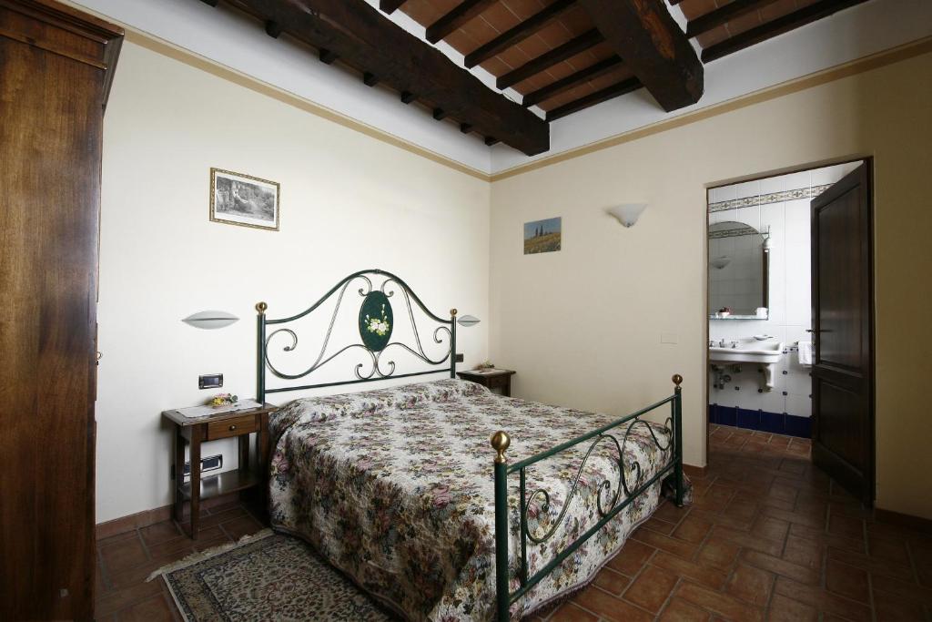 Postel nebo postele na pokoji v ubytování Agriturismo Sanguineto