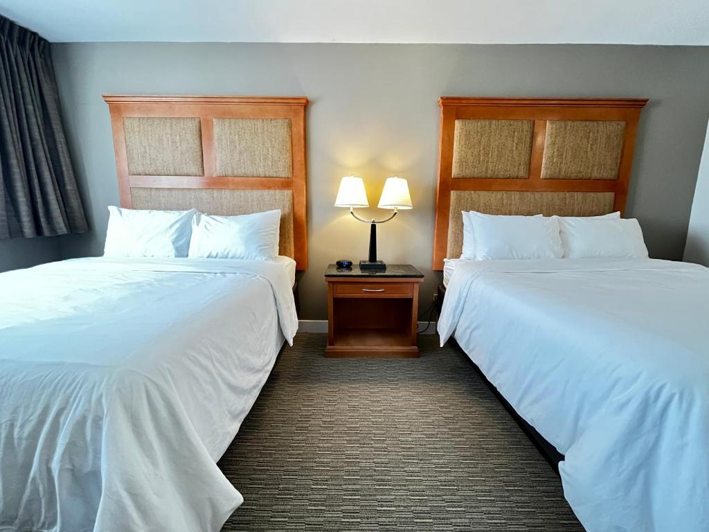 Postel nebo postele na pokoji v ubytování Anavada Inn & Suites - Prince George