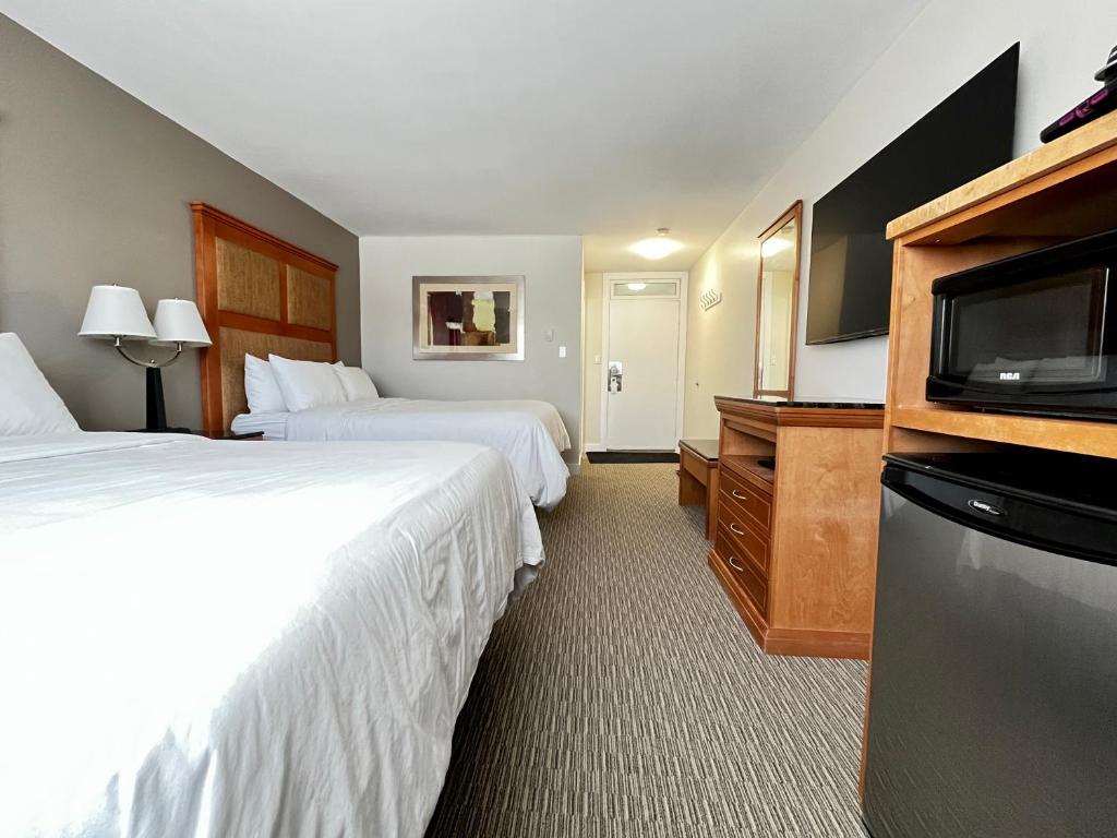 Postel nebo postele na pokoji v ubytování Anavada Inn & Suites - Prince George