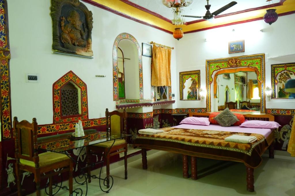 a bedroom with a bed and a mirror at Kasera Paradise in Būndi