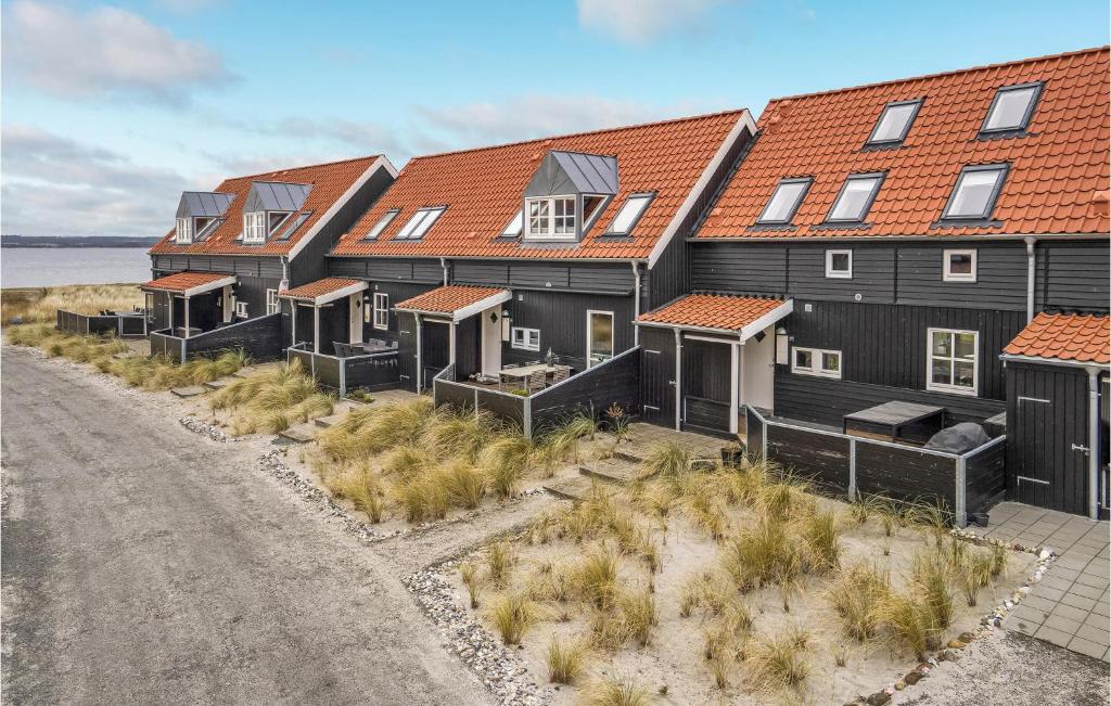 an aerial view of a row of houses on the beach at Stunning Home In Juelsminde With Wifi And 3 Bedrooms in Juelsminde