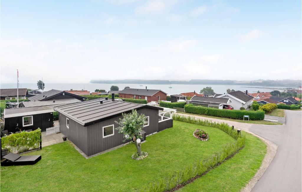 a house with a small yard with grass at Pet Friendly Home In Hejls With Wifi in Hejls