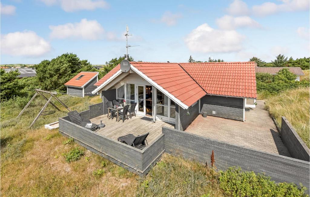 an overhead view of a house with an orange roof at Awesome Home In Hvide Sande With Sauna in Bjerregård