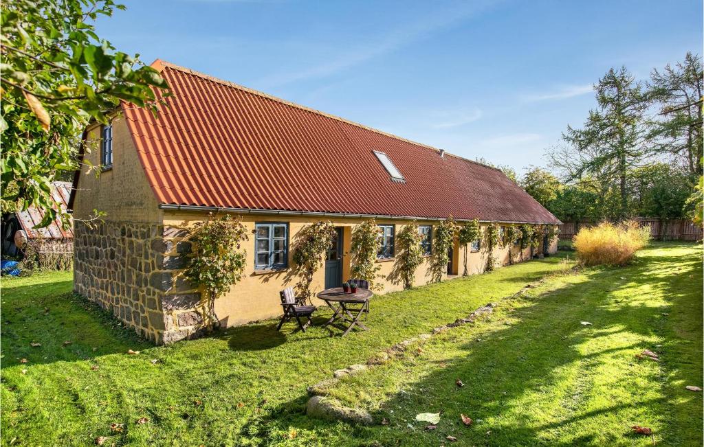 an old stone house with a red roof at 2 Bedroom Stunning Apartment In Aabenraa in Aabenraa