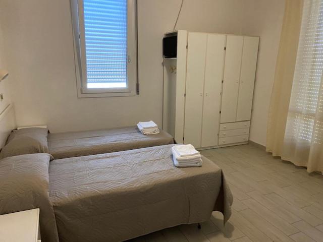 Postel nebo postele na pokoji v ubytování Hotel Primula