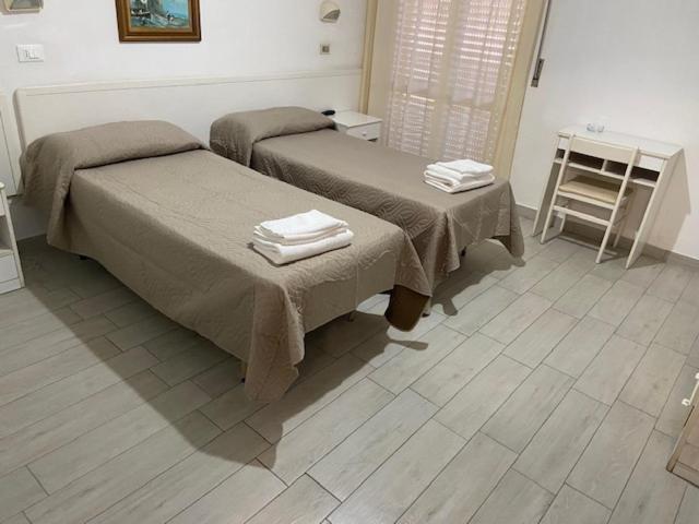 Postel nebo postele na pokoji v ubytování Hotel Primula