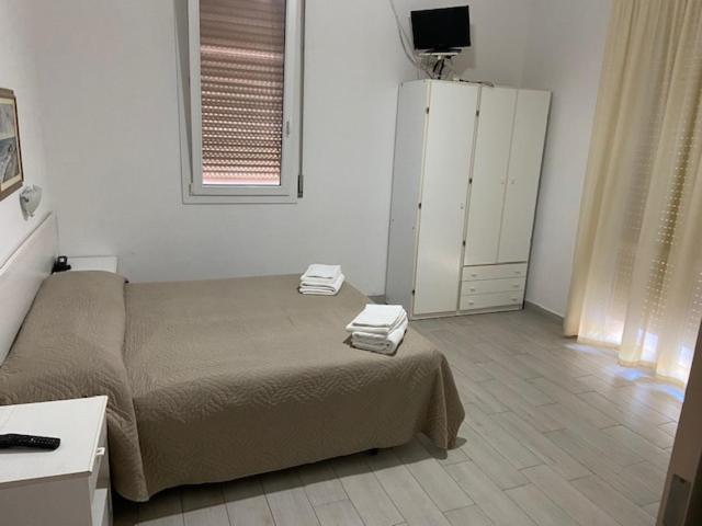 Postel nebo postele na pokoji v ubytování Hotel Primula