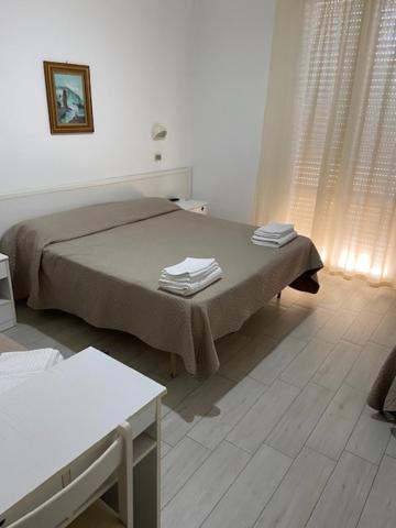 Postel nebo postele na pokoji v ubytování Hotel Primula