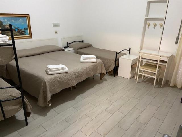 Postel nebo postele na pokoji v ubytování Hotel Primula
