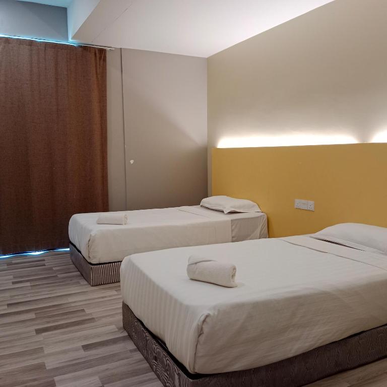 Postel nebo postele na pokoji v ubytování TOWERMAS HOTEL