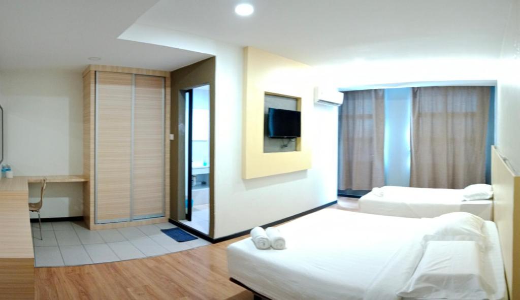 Postel nebo postele na pokoji v ubytování TOWERMAS HOTEL