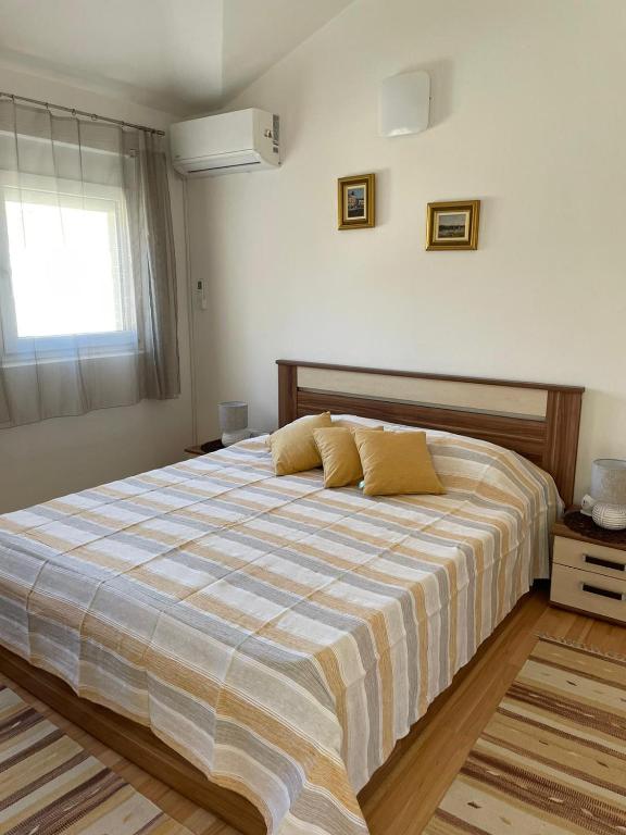 Postel nebo postele na pokoji v ubytování Apartman Tratica Ugljan