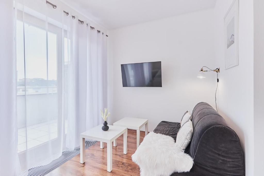 Telewizja i/lub zestaw kina domowego w obiekcie Apartamenty Platan - visitopl