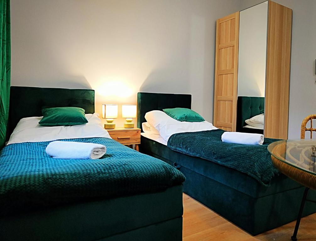 Postel nebo postele na pokoji v ubytování Hugo Eden Apartments