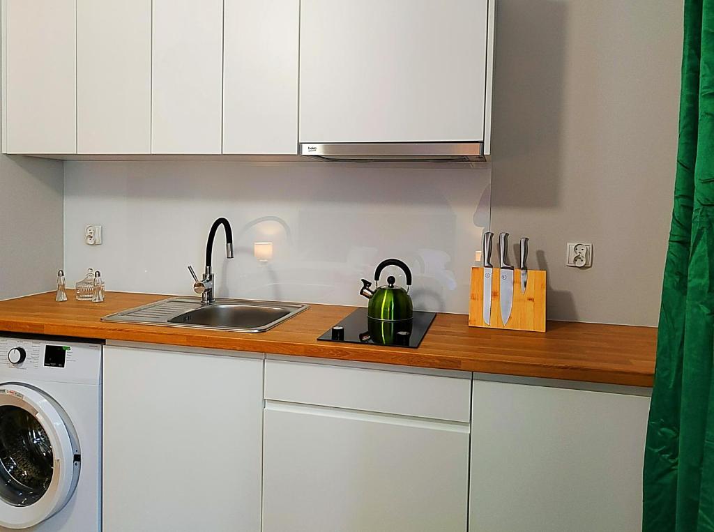 Kuchyň nebo kuchyňský kout v ubytování Hugo Eden Apartments