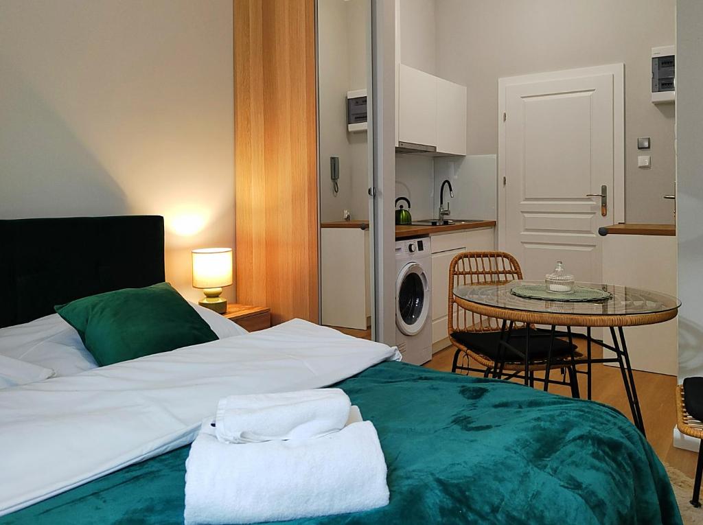 Postel nebo postele na pokoji v ubytování Hugo Eden Apartments